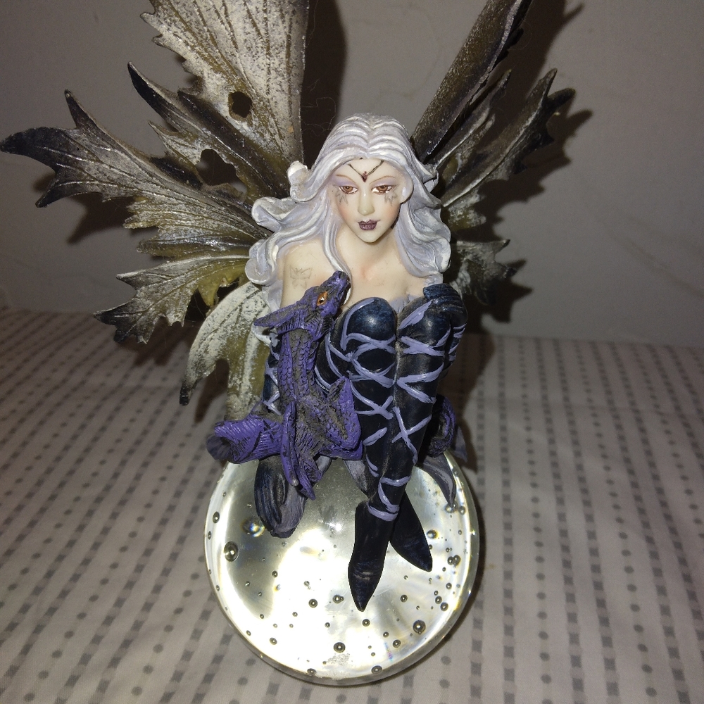 Fairy figurine on crystal ball
